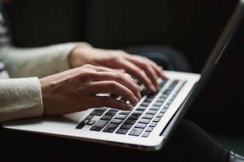 Laptop Typing On Keyboard