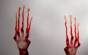 Ghost Horror Hand With Blood in Glass Photo