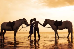 Romantic Couple on Beach with Horse