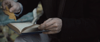 Guy Puts Leaf In Book Placeholder Animated Gif